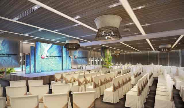 Modern event space at The Commune, featuring a stylish stage for corporate conferences.