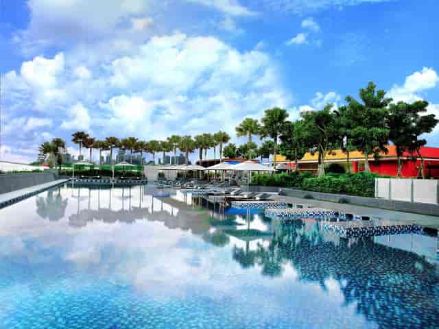 Outdoor event venue at Village Hotels with serene pool and modern architecture.