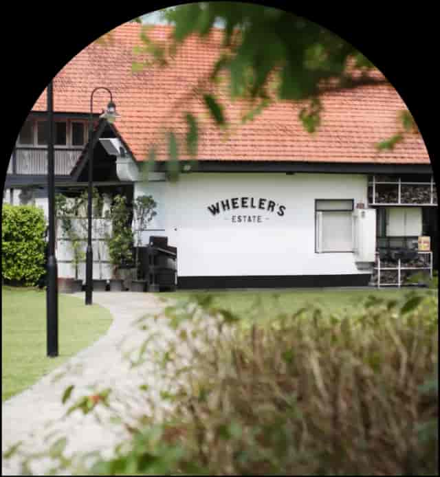 Business seminar at Wheeler's Estate, featuring modern design and lush surroundings.