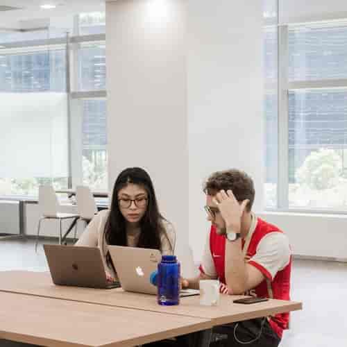 Professionals collaborating in a modern workspace for event planning and teamwork.