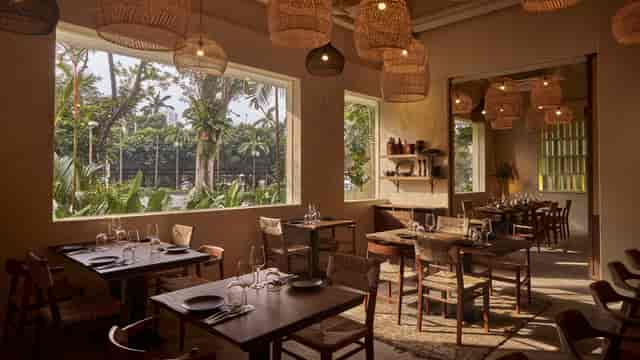 Elegant restaurant space with natural light, perfect for gatherings and corporate events.
