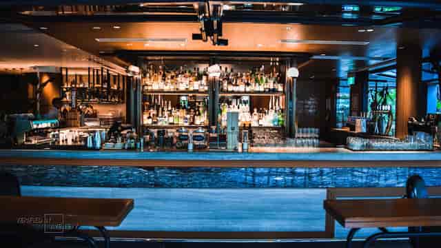 Sleek modern bar in Publico, ideal for networking events and social gatherings.