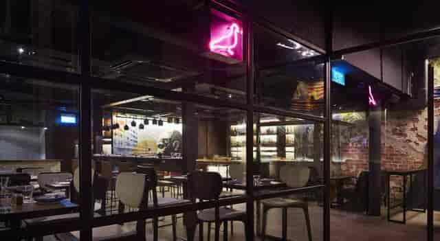 Modern Japanese restaurant with neon decor, ideal for corporate events and gatherings.