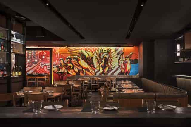 Vibrant Japanese restaurant with mural, perfect for networking events and dinners.