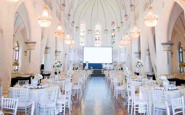 Elegant CHIJMES Hall with round tables, ideal for weddings and corporate events.