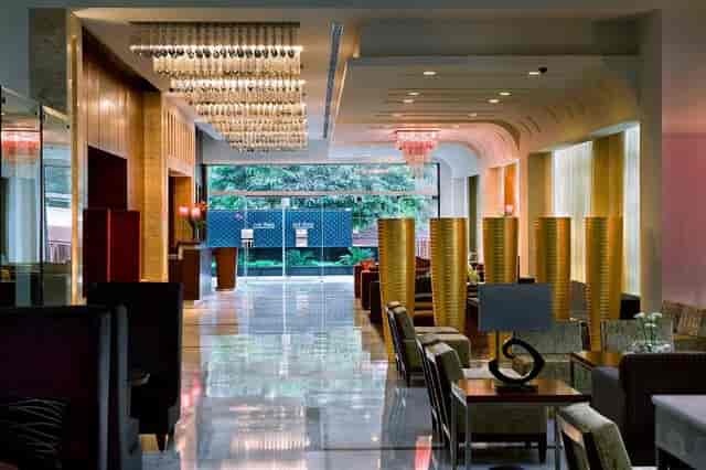 Sophisticated hotel lobby with elegant lighting, ideal for corporate events and meetings.