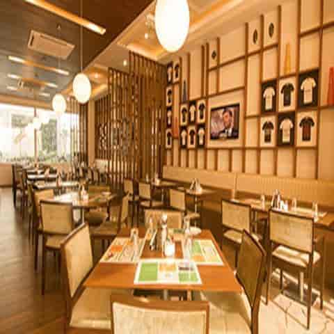 Modern restaurant in Lemon Tree Hotel Gurugram, ideal for casual meetings and events.