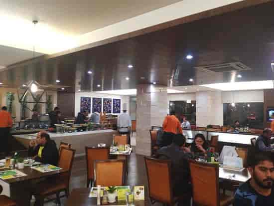 Vibrant dining space at Lemon Tree Premier Delhi Airport for corporate events and gatherings.