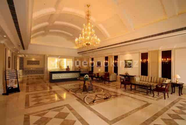 Elegant hotel lobby with chandelier, perfect for conferences and networking events.