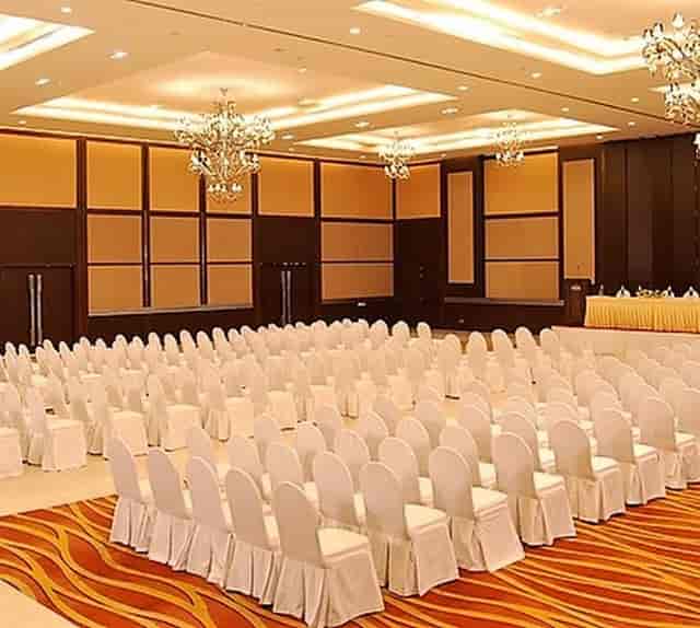 Banquet setup with elegant chairs at Country Inn & Suites for conferences and seminars.