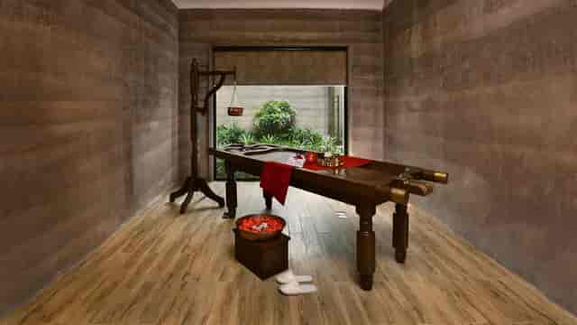 Serene spa treatment room at The LaLiT Mangar for wellness retreats and corporate events.