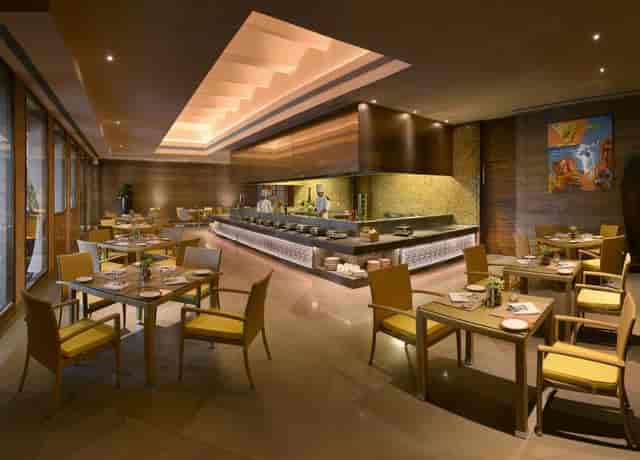 Outdoor event space at The LaLiT Mangar, featuring modern dining for intimate gatherings.