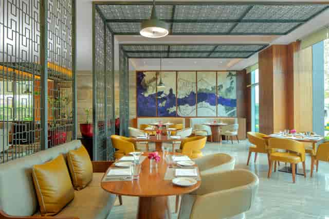 Modern dining space at Radisson Blu Hotel, ideal for intimate meetings and events.
