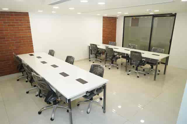 Modern conference room in Chandigarh with ergonomic chairs for team meetings.