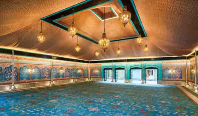 Elegant event space in Fairmont Jaipur with intricate ceiling details, ideal for gatherings.