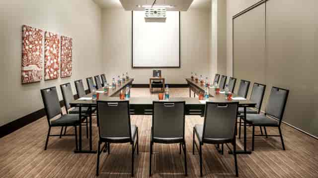 Conference Hall in Udyog Vihar, U-shaped seating for workshops and strategy sessions.