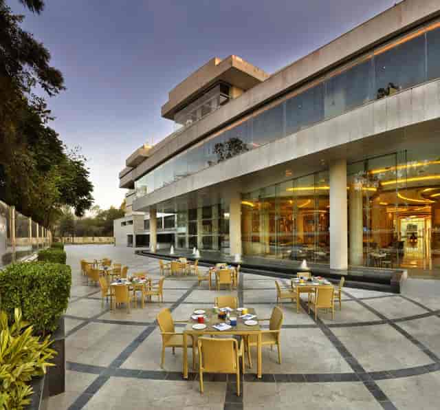 Modern outdoor dining area at The LaLiT Chandigarh, ideal for upscale events and gatherings.