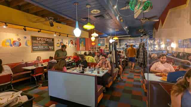Vibrant diner interior at Johnny's Luncheonette, perfect for casual gatherings and events.