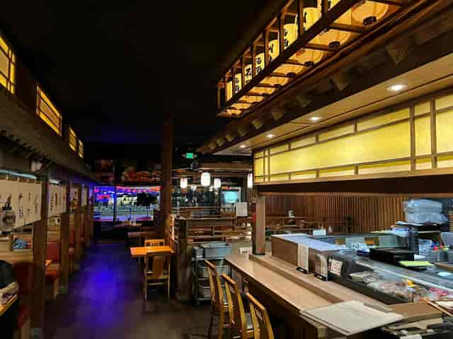 Cozy Oishi Sushi restaurant with warm lighting, ideal for intimate gatherings and events.