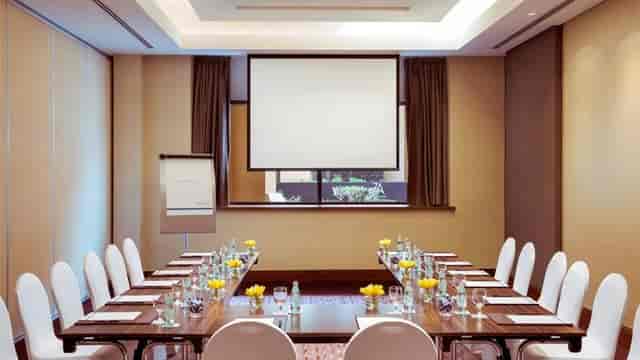Sadaf Ballroom meeting room with long table, ideal for conferences and events.