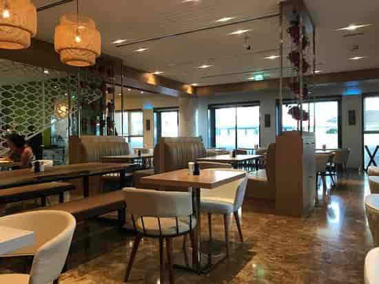 Modern dining space at The First Collection Marina, perfect for networking events.