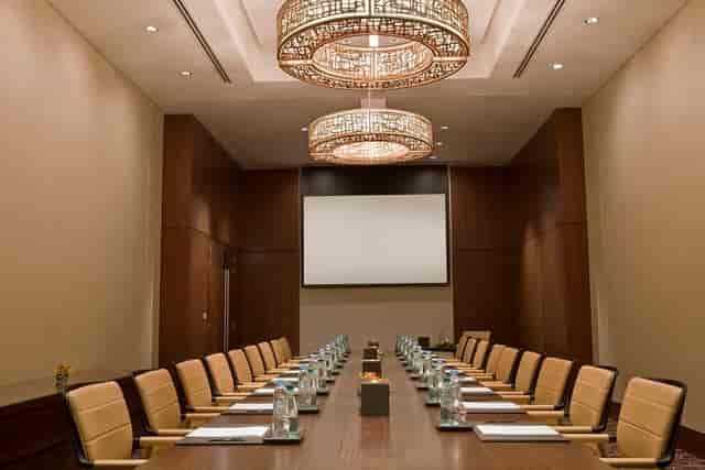 Sophisticated conference room with elegant chandeliers for corporate events.