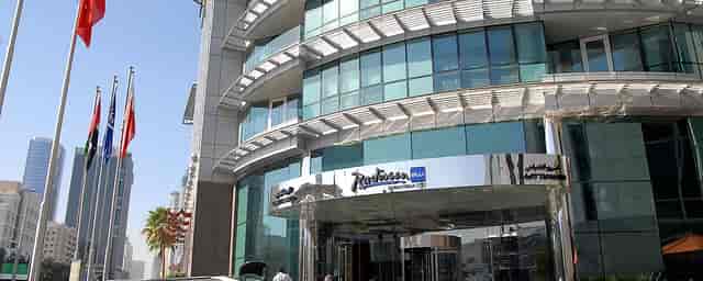 Radisson Blu Hotel Dubai exterior, modern architecture for corporate events and meetings.