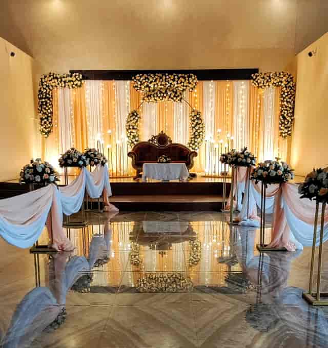 Elegant banquet hall in Kathmandu, ideal for weddings with floral arrangements.