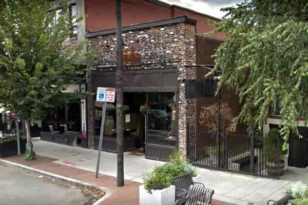 Charming Giulia Restaurant with rustic brick facade, perfect for networking events and gatherings.