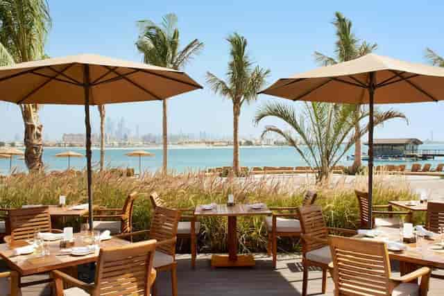 Maui Beach Restaurant outdoor dining with elegant furniture, ideal for events in Dubai.