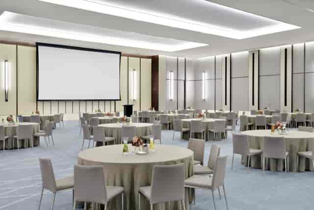 Ballroom at Address Hotels, featuring round tables for meetings and events.