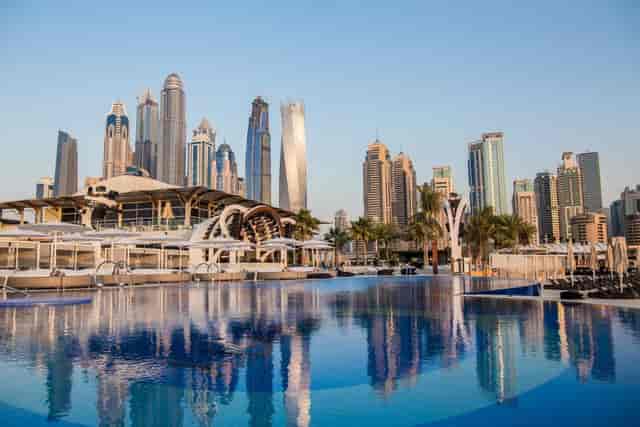 Luxurious garden venue with pool and skyline, perfect for corporate events in Dubai.