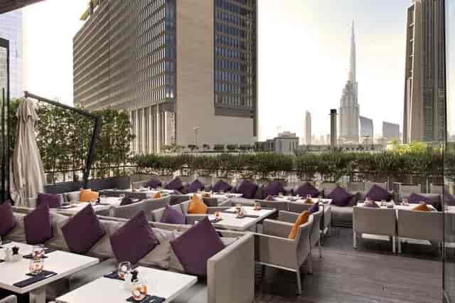 Stylish outdoor venue at Roberto's with Burj Khalifa, ideal for upscale events and receptions.