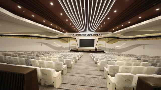 Modern conference hall in Mohammed Bin Rashid Library with tiered seating for events.