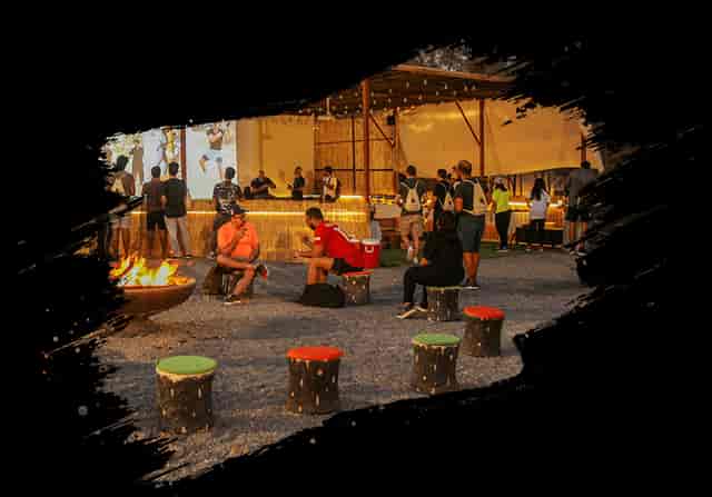 Outdoor classroom event space with fire pit, ideal for networking and casual receptions.