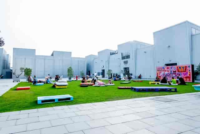 Vibrant outdoor event space in Alserkal Avenue with colorful seating for gatherings.