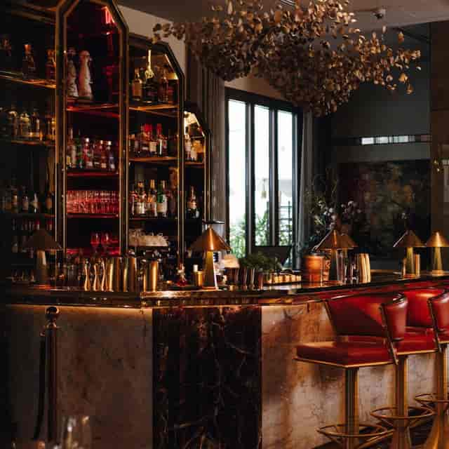 Stylish bar area in Alaya event space, perfect for networking and cocktail receptions.
