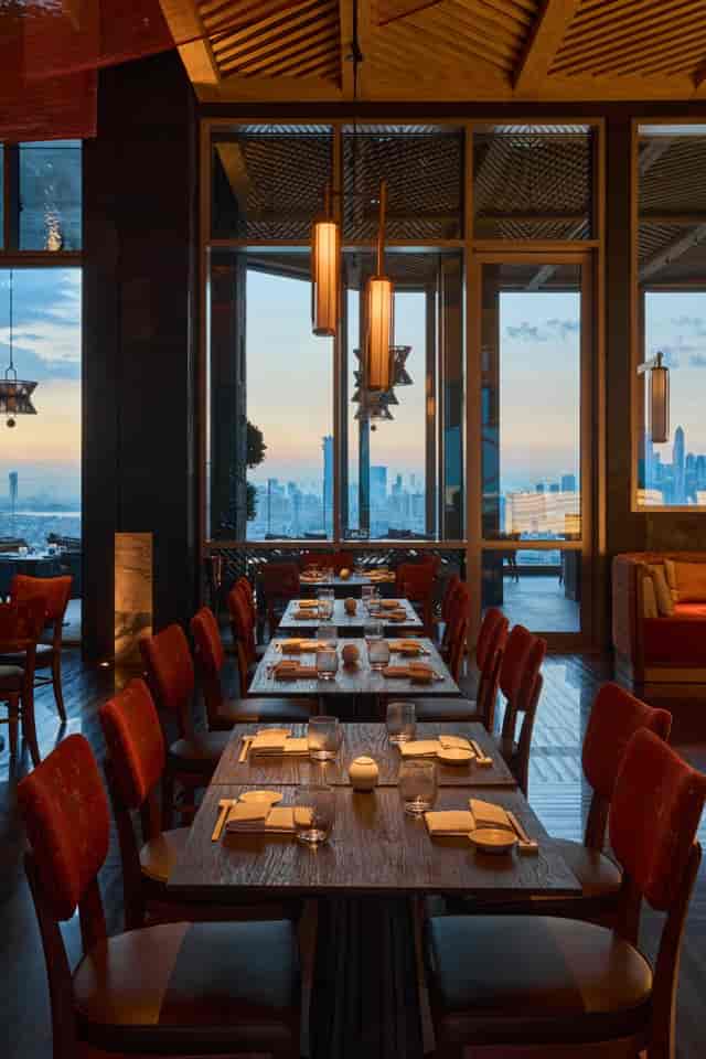 Elegant dining space at Nobu Dubai with skyline view, ideal for upscale events.
