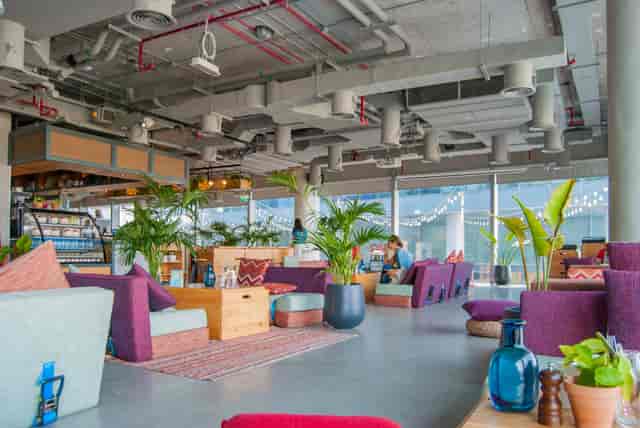 Modern lounge area in One Life restaurant, ideal for networking events and meetings.