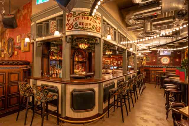 Bar area at Flight Club Edinburgh, vibrant decor for networking events and gatherings.