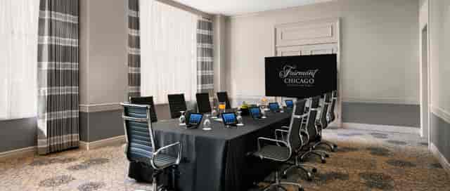 Cuvee Room at Fairmont Chicago: modern corporate meeting space with tablets and elegant decor.
