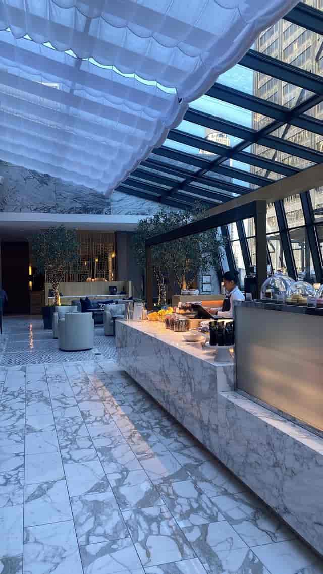 Rooftop bar at The Ritz-Carlton, Chicago with elegant marble counter for events.