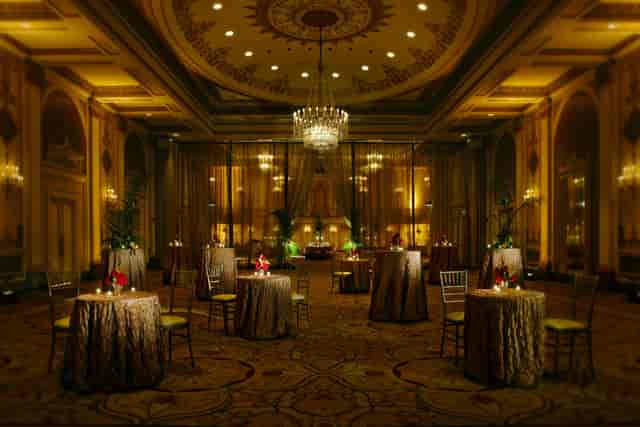 Elegant ballroom at Palmer House Hilton with luxurious tables for upscale events.
