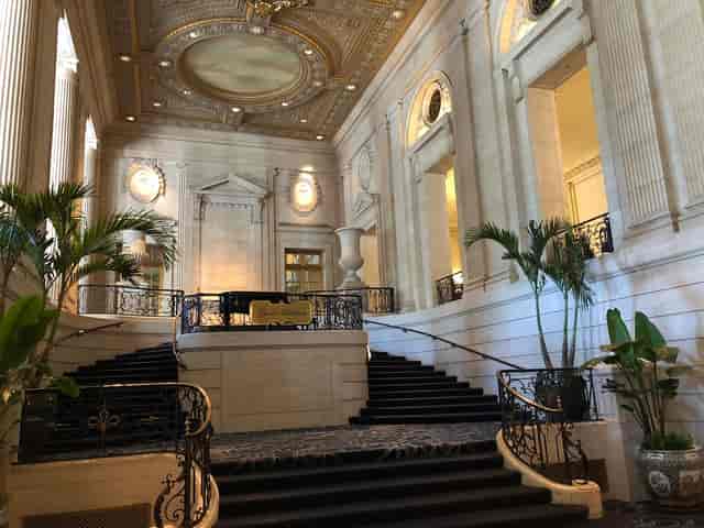 Elegant Hilton Chicago ballroom with grand staircase, perfect for galas and corporate events.