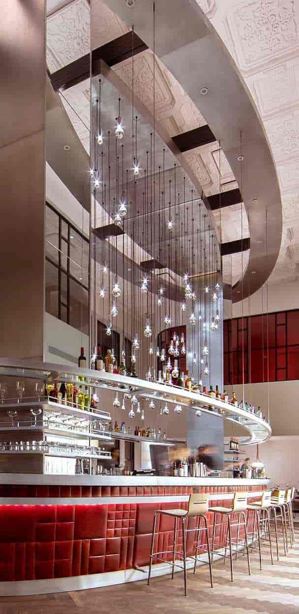 Modern bar in Virgin Hotels Chicago with elegant pendant lighting for cocktail receptions.