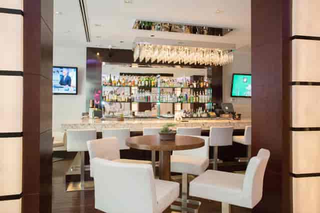 Modern bar area at Divine Lounge, Ivy Hotel - ideal for networking events and meetings.