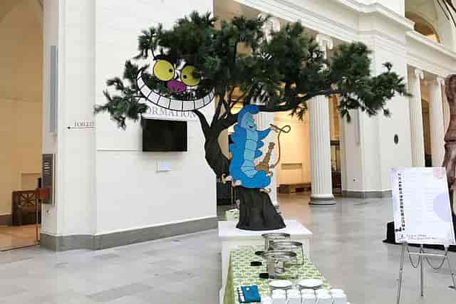 Whimsical East Atrium setup with tree, caterpillar for themed children's events.