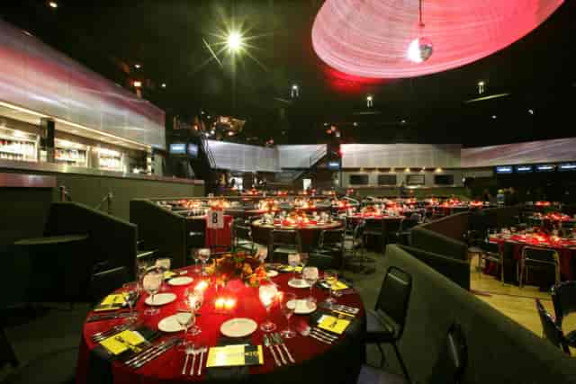Elegant Green Room at Venue West Chicago set for formal dinner event.