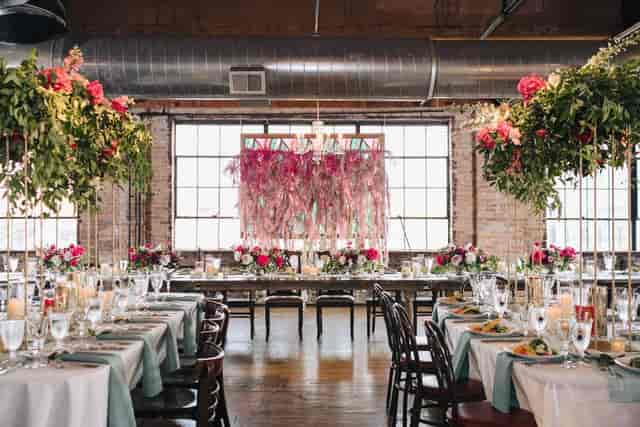 Elegant event space at Salvage One with floral centerpieces, perfect for weddings and corporate events.