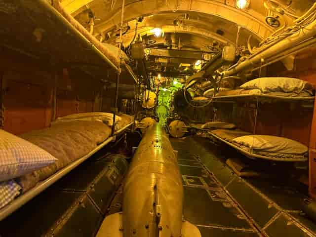 U-505 Submarine interior with bunk beds for unique team-building events.